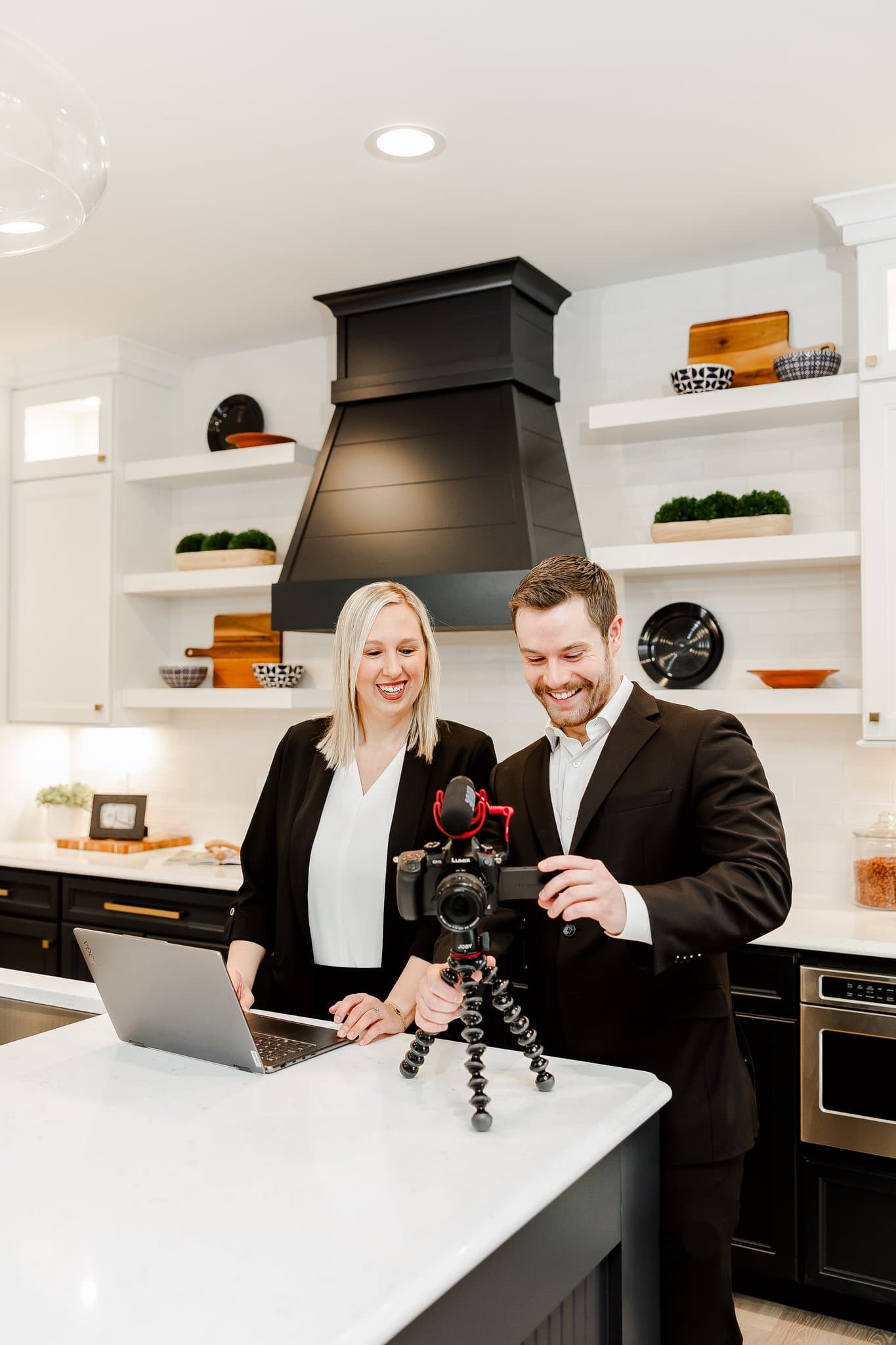 Jacob filming content with a Gateway Realty Group teammate